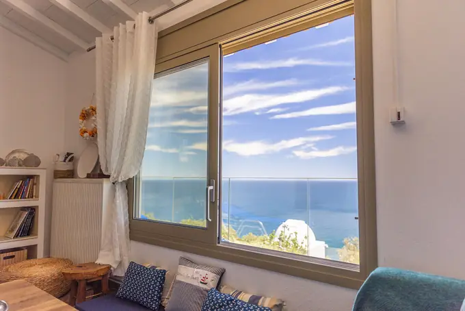 A picture window framing the Aegean