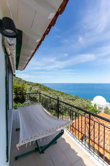 A hammock on the balcony looking out to sea