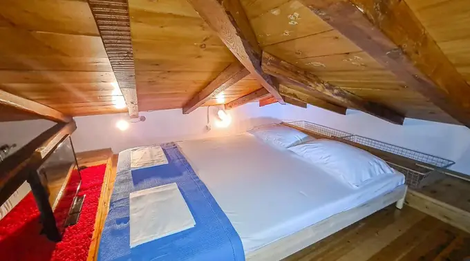 Attic bedroom under exposed timber beams