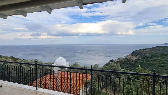 The sea and green hills from the balcony