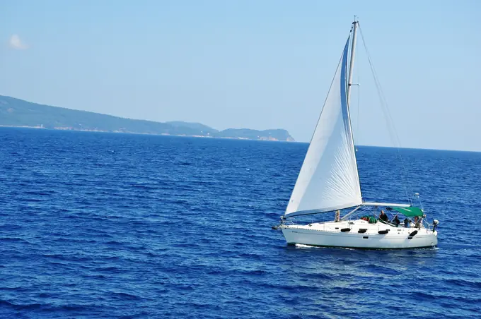 A sailing yacht on open blue water